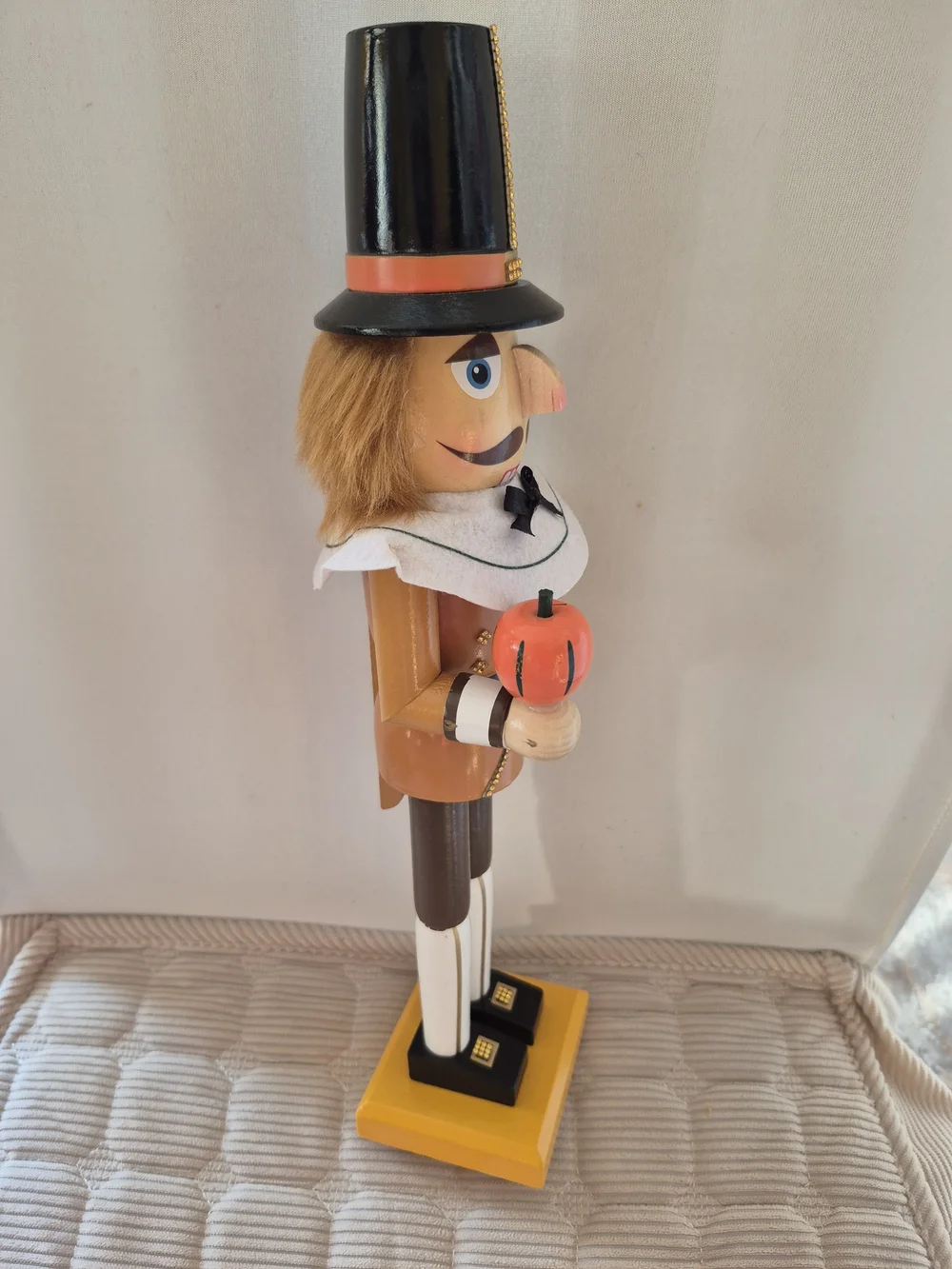 Wooden Pilgrim Nutcracker with Orange Hat and Pumpkin